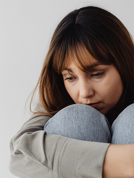 A lady thinking deeply about realty financing.