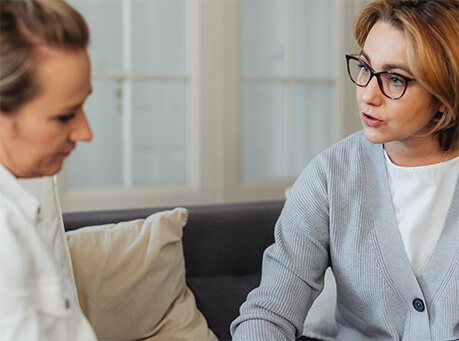 Two ladies talking about realty financing by Preston